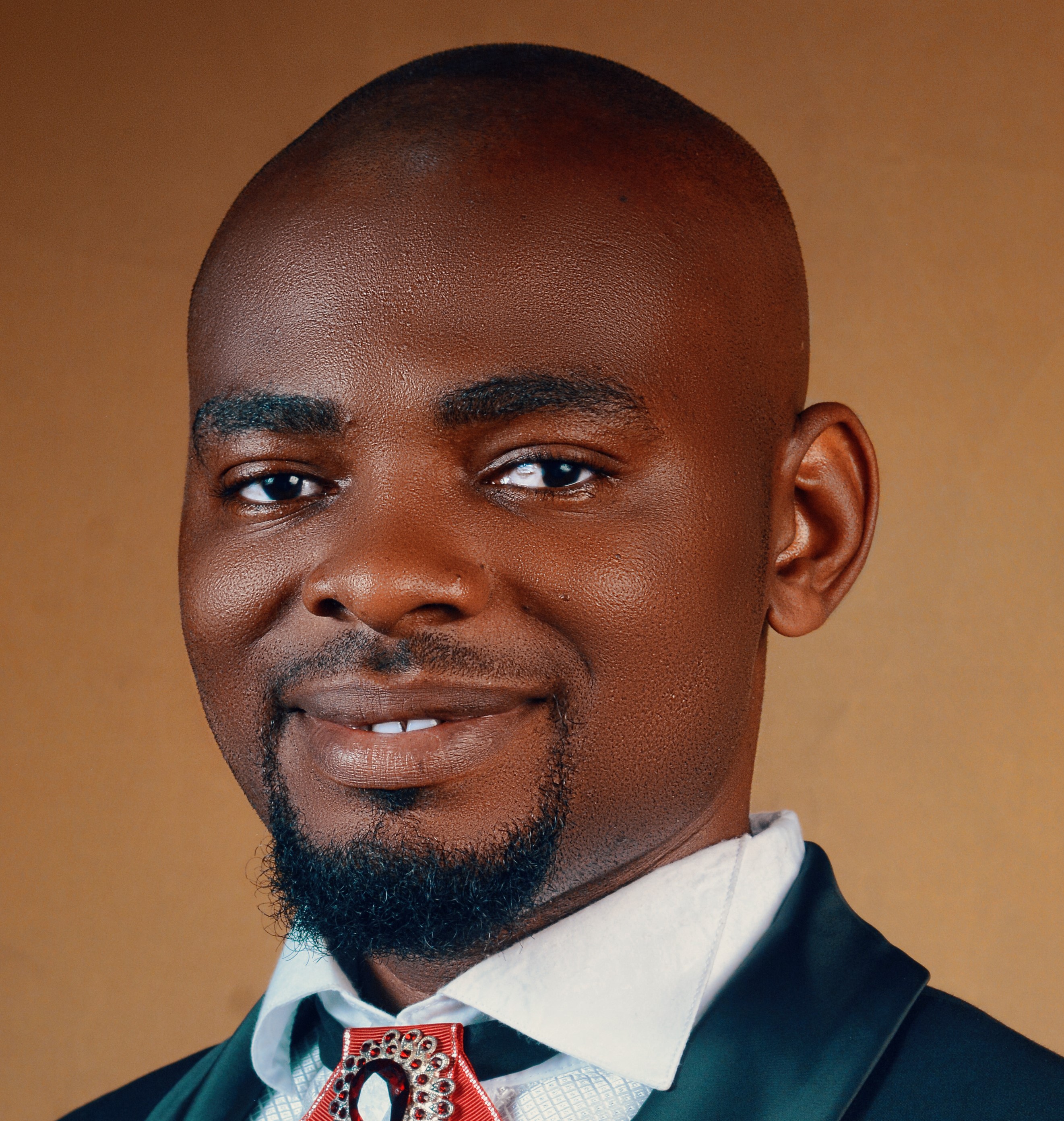 Professional headshot of ENGR. AUGUSTINE UMELIWU the Manager